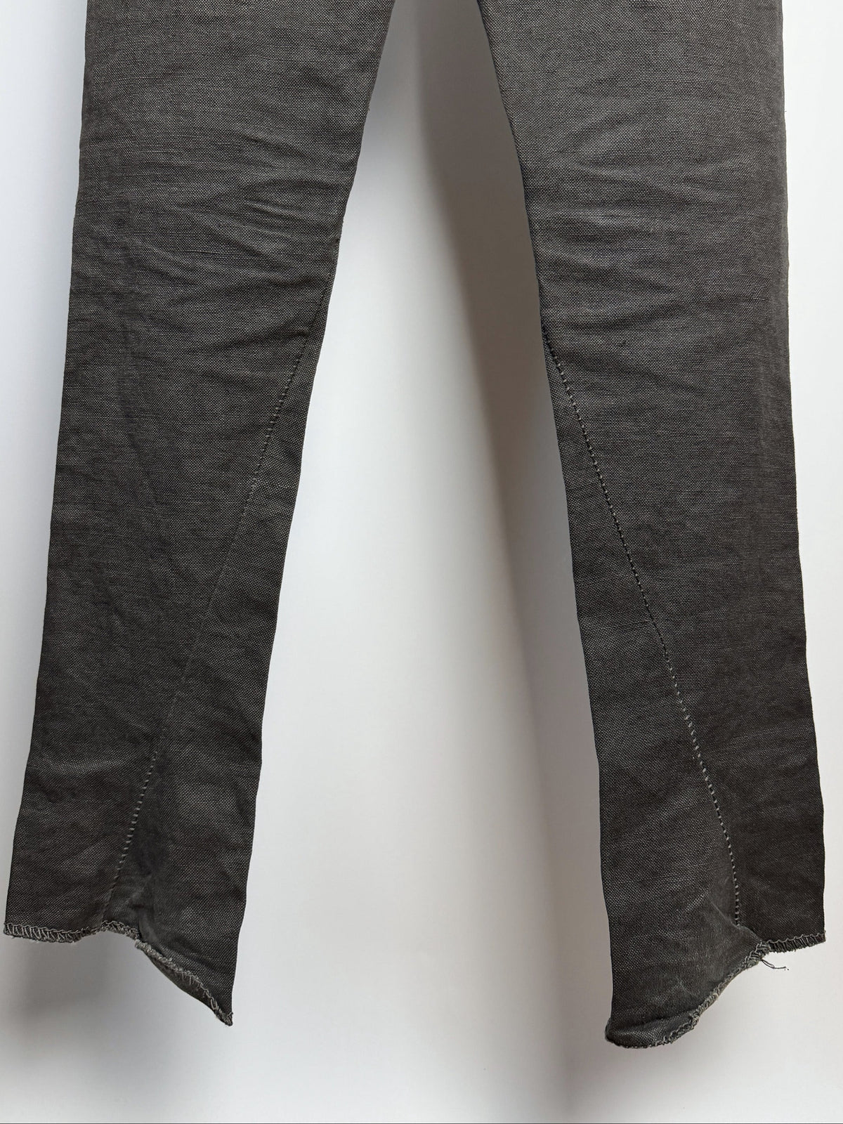 Legs, seams curving into the hems