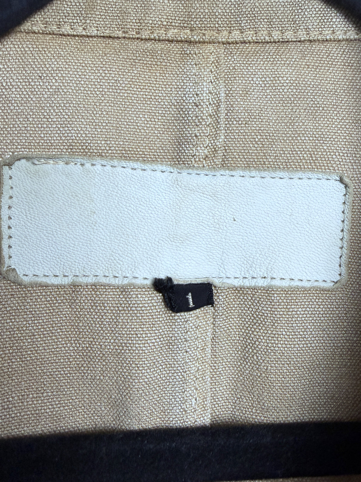 White leather patch, printing worn away