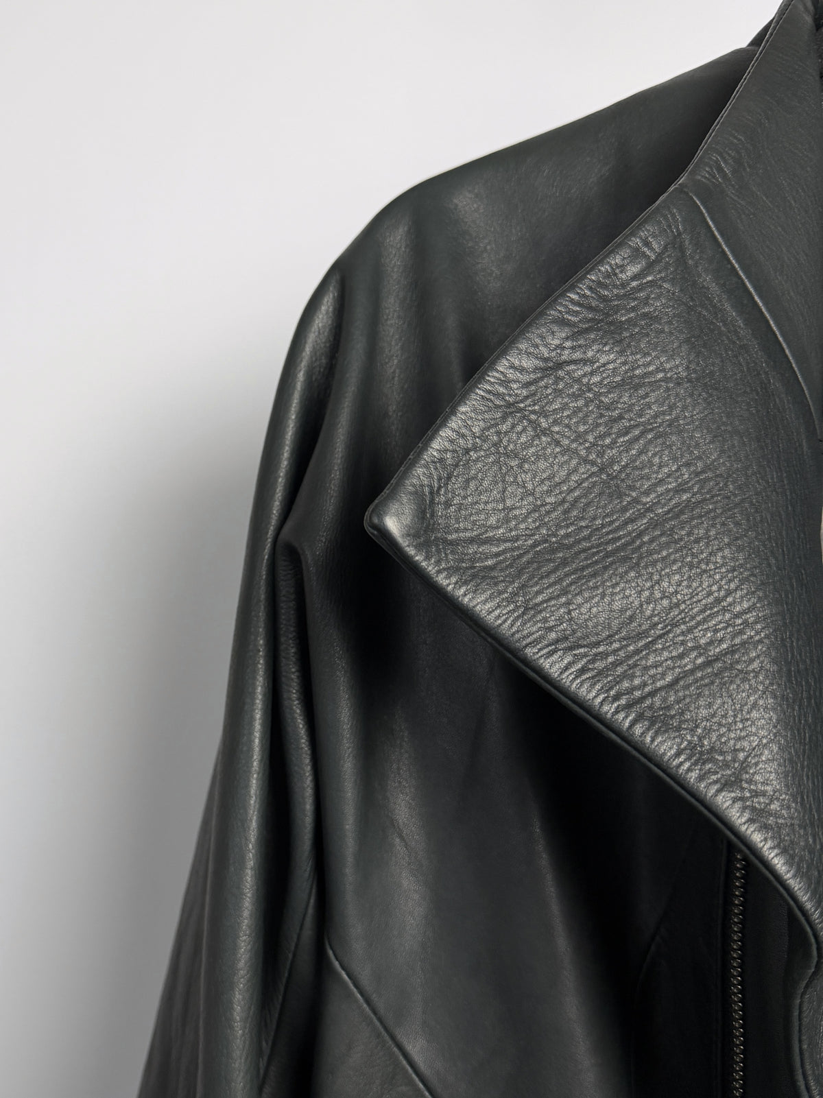 High collar and off-centre zip