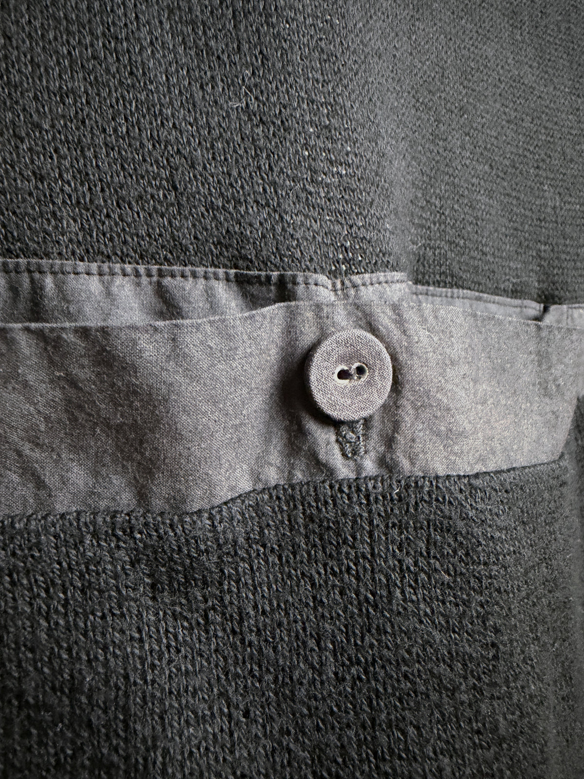 Back pocket button and cloth band