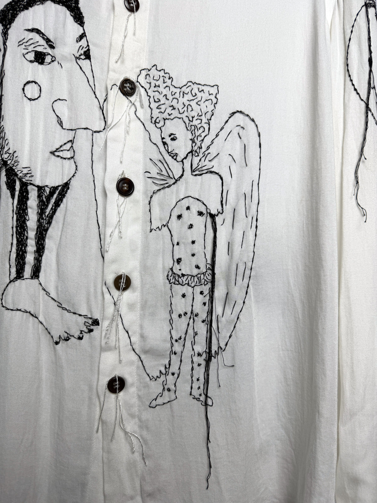 Man in profile and winged figure, close