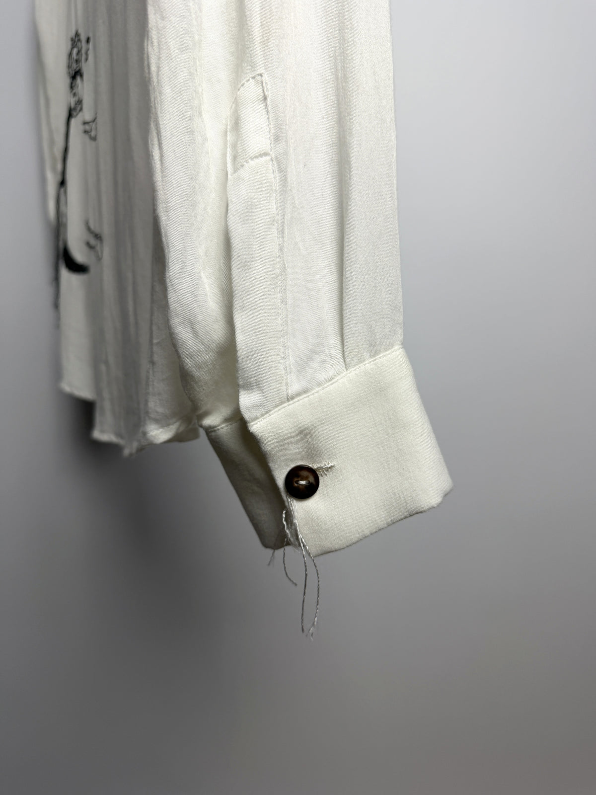 Cuff, button and thread ends