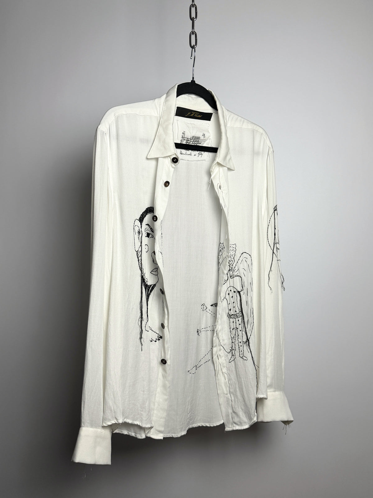 Shirt open, showing the inside