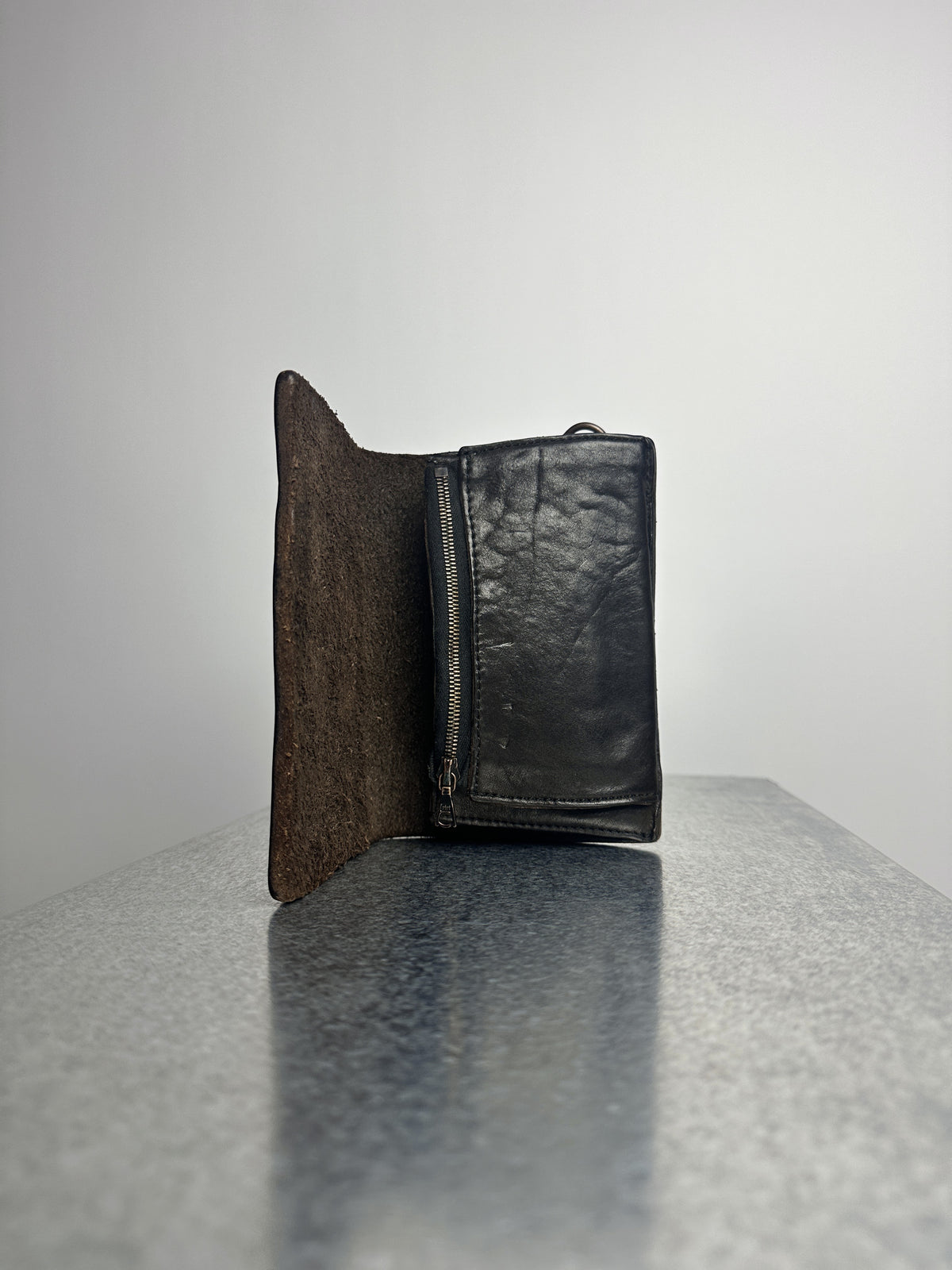Open, raw flesh side and zip compartment