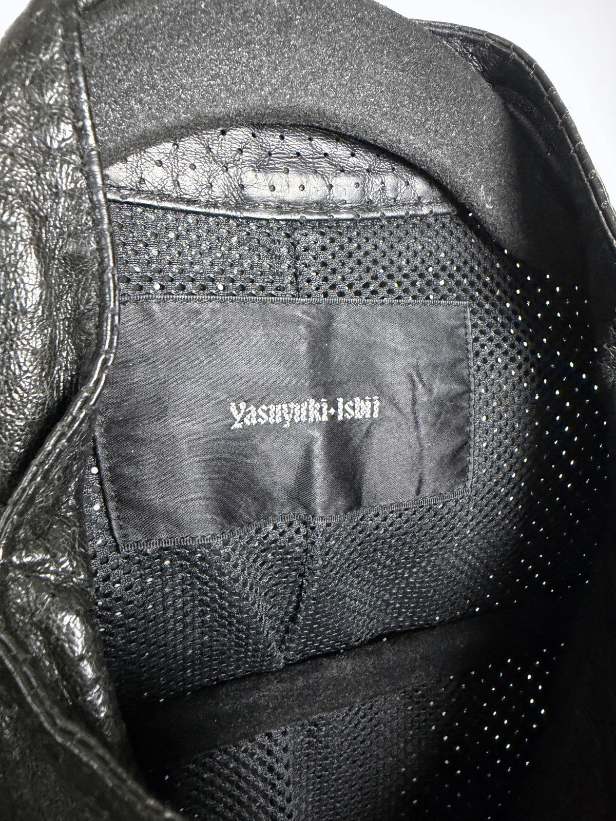 Yasuyuki Ishii label over the mesh lining