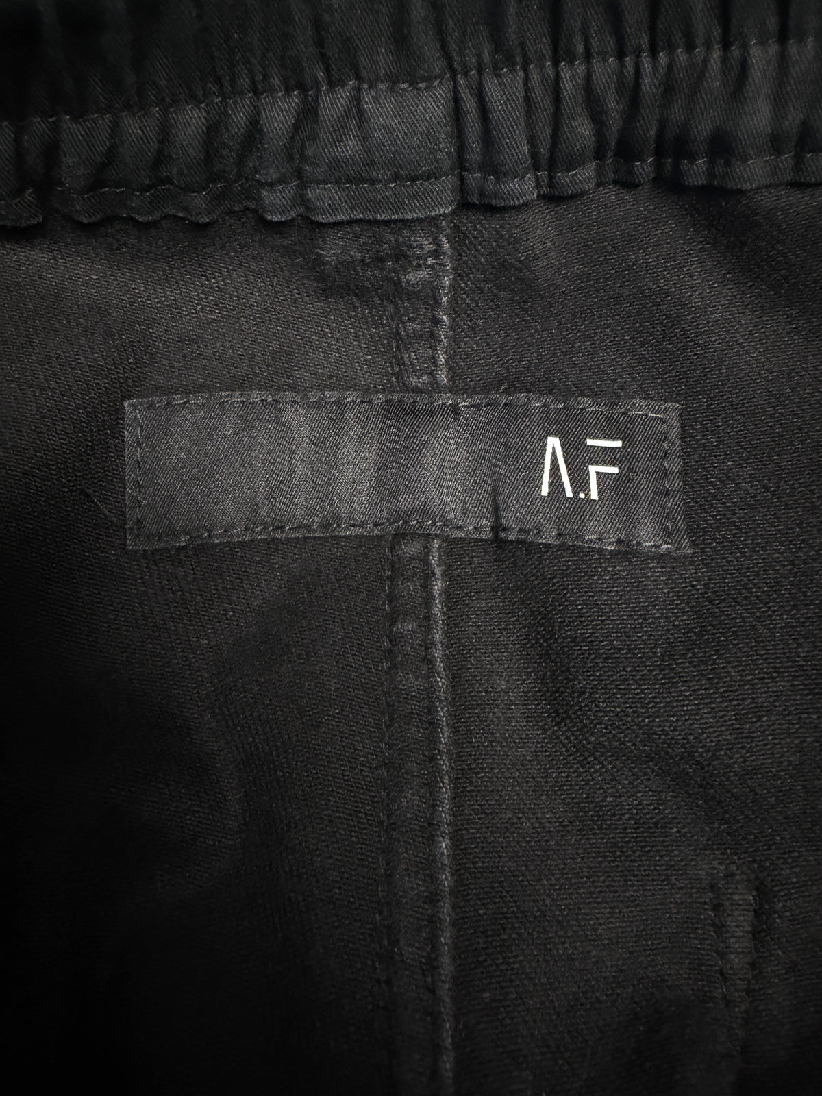 A.F Artefact Coated Drawstring Flared Trousers