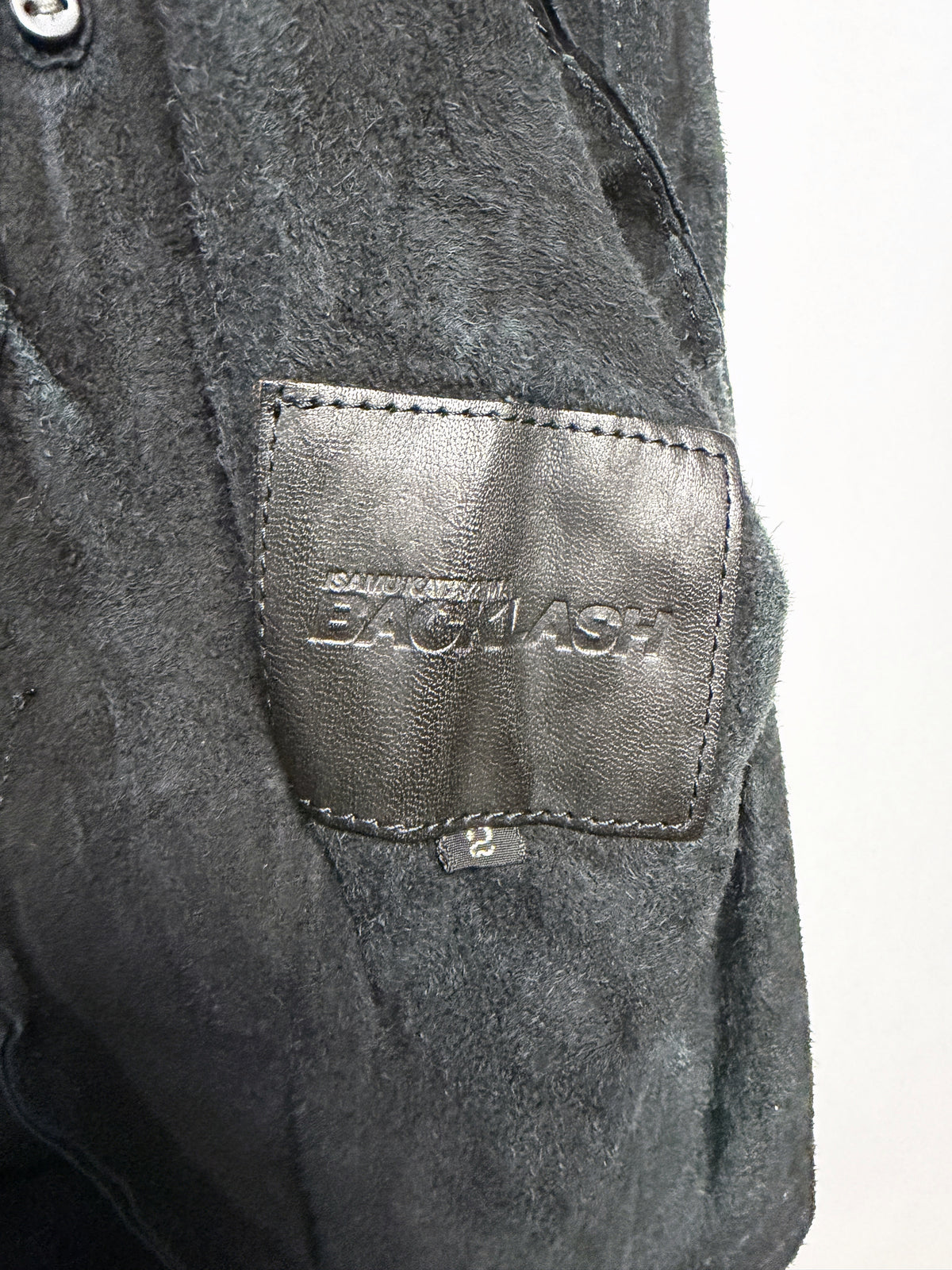 Embossed leather BACKLASH patch, size 2