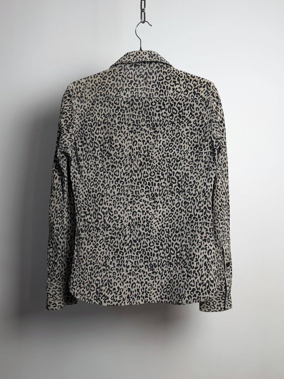 Front, open, showing the perforated white leather facing