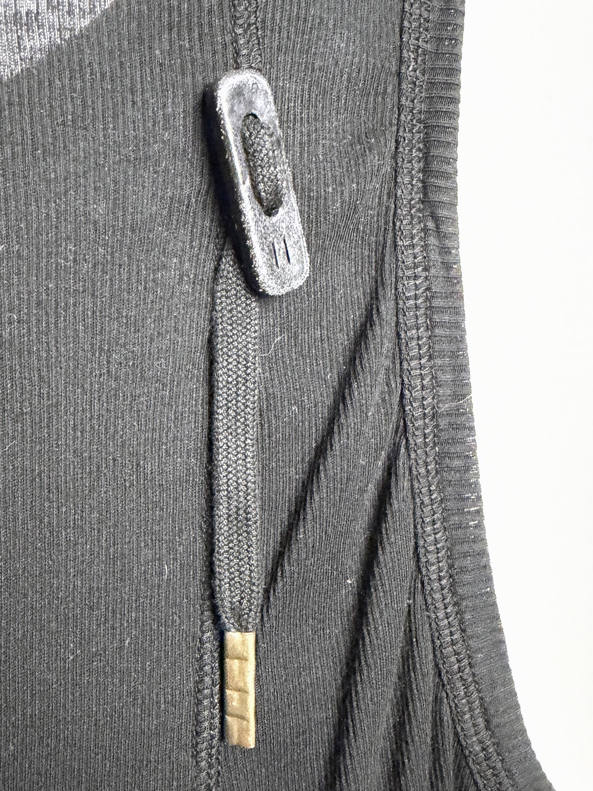 Braided drawcord, leather toggle and metal tip