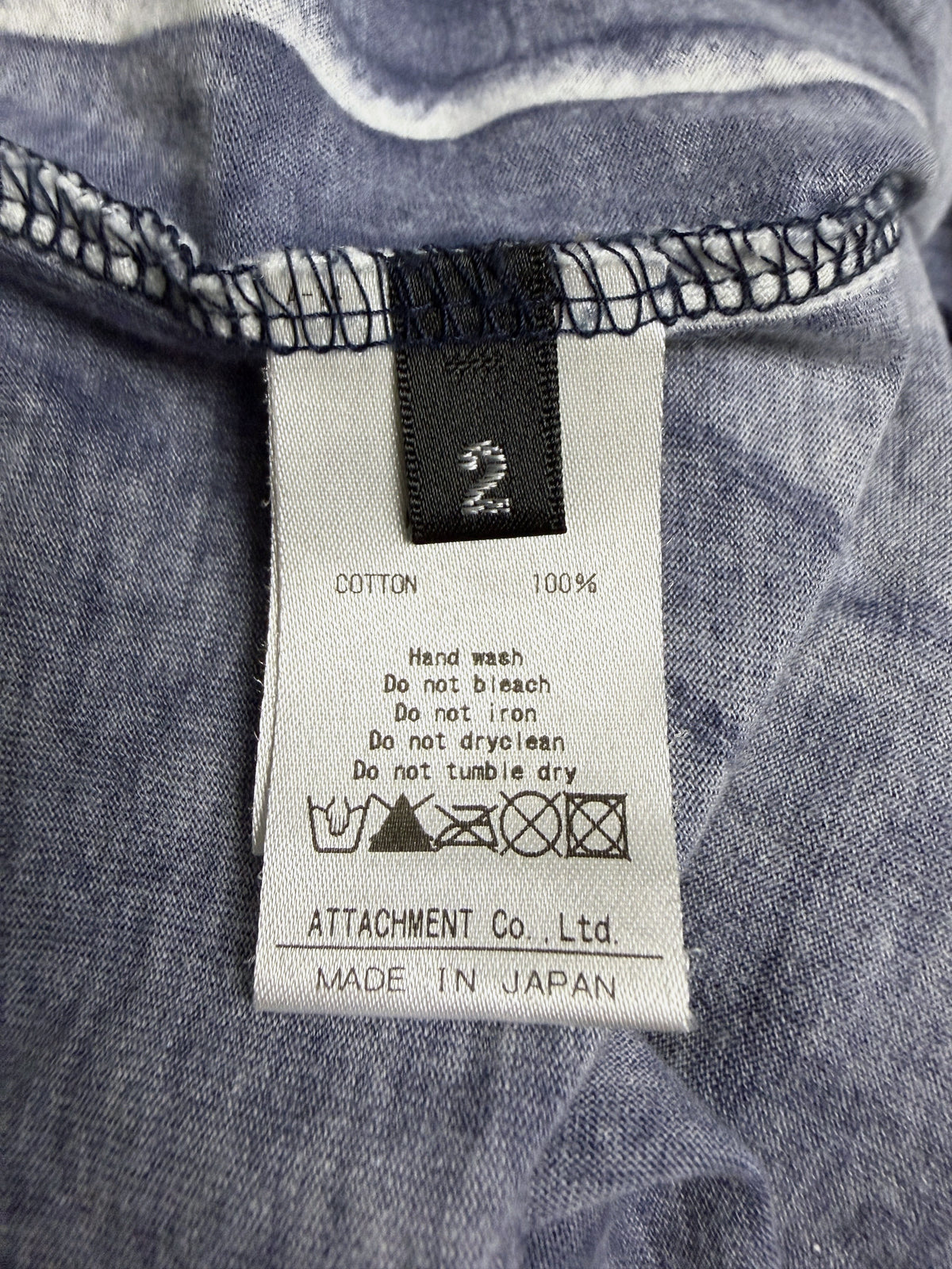 Kazuyuki Kumagai ATTACHMENT cold dyed tee, care label