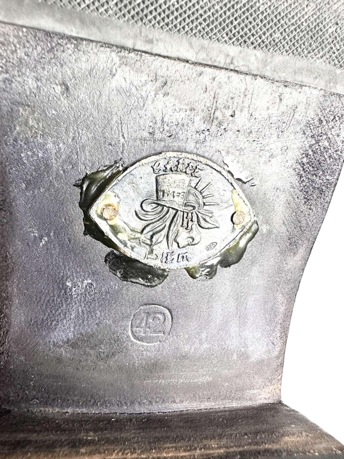 Sterling silver seal and circled 42 stamp at the outsole waist