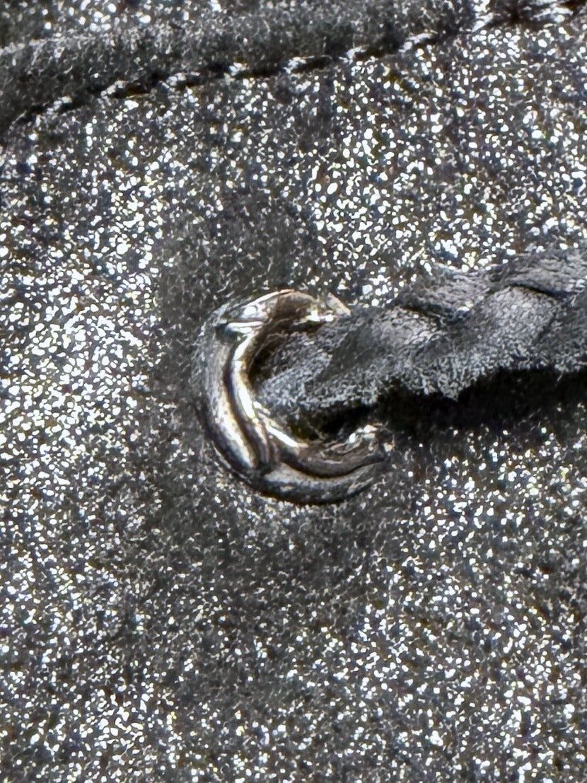 Cast scroll grommet, macro