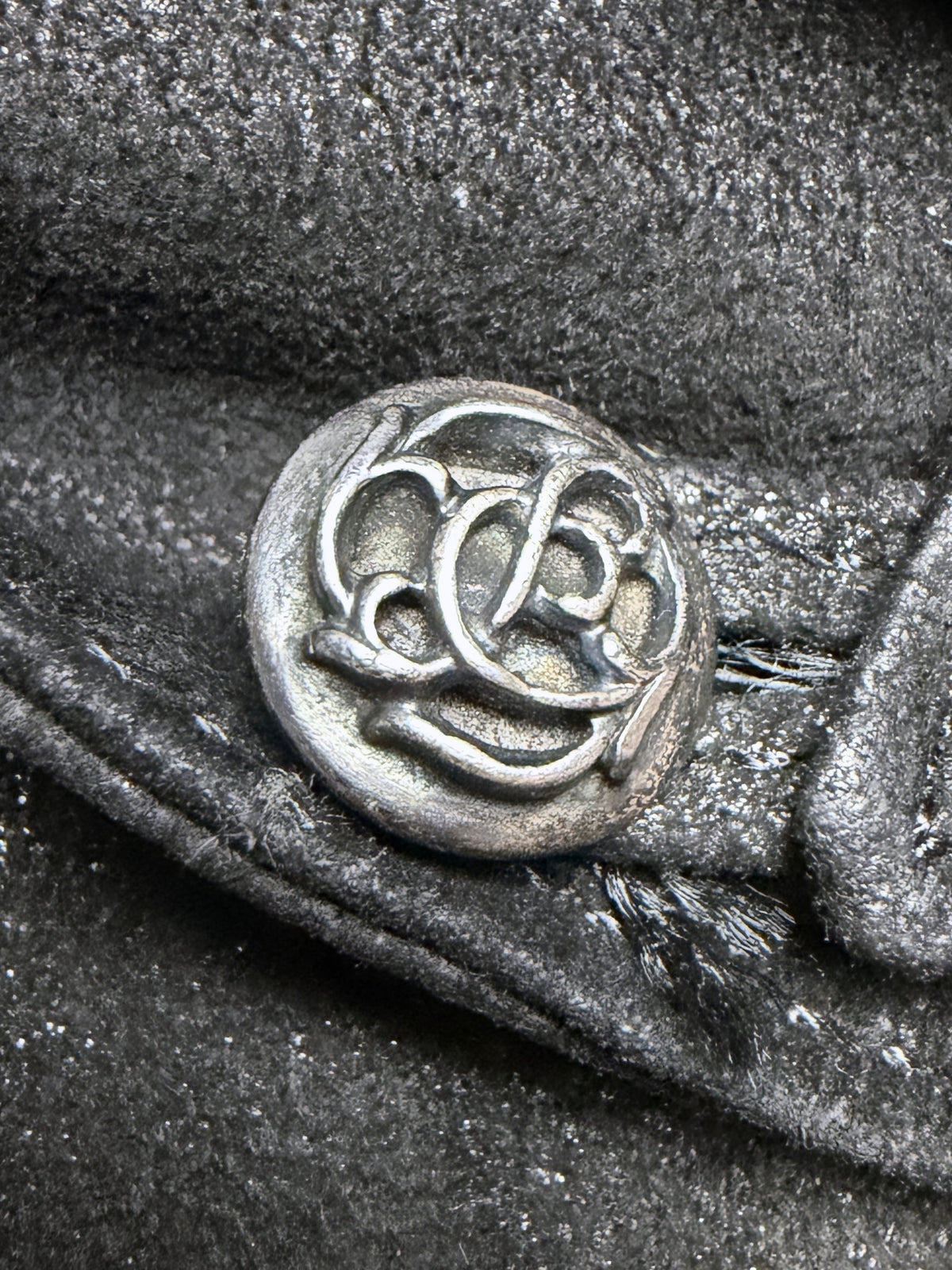 Cast CH monogram button at the waist tab