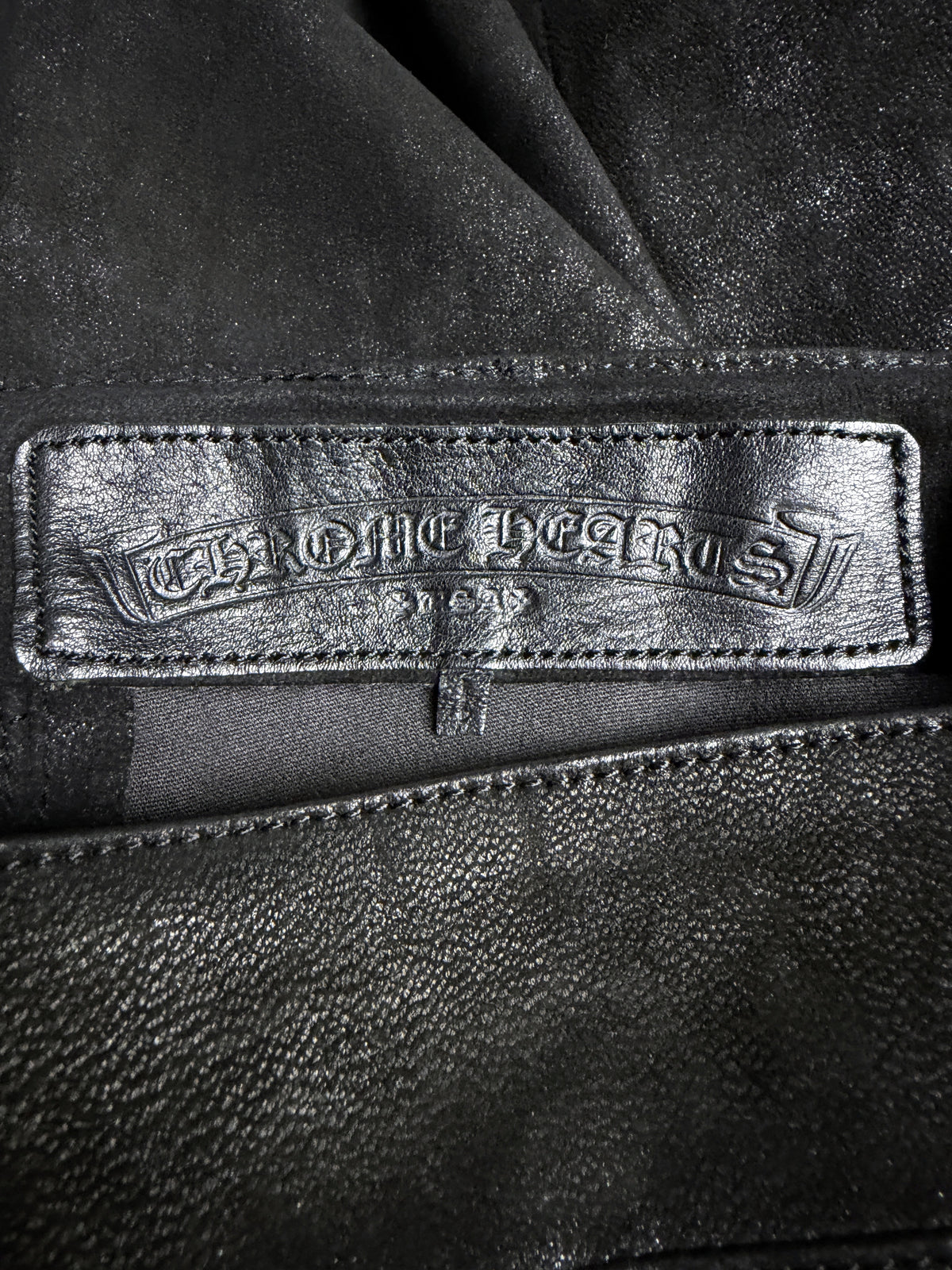 Embossed CHROME HEARTS leather patch, interior waist
