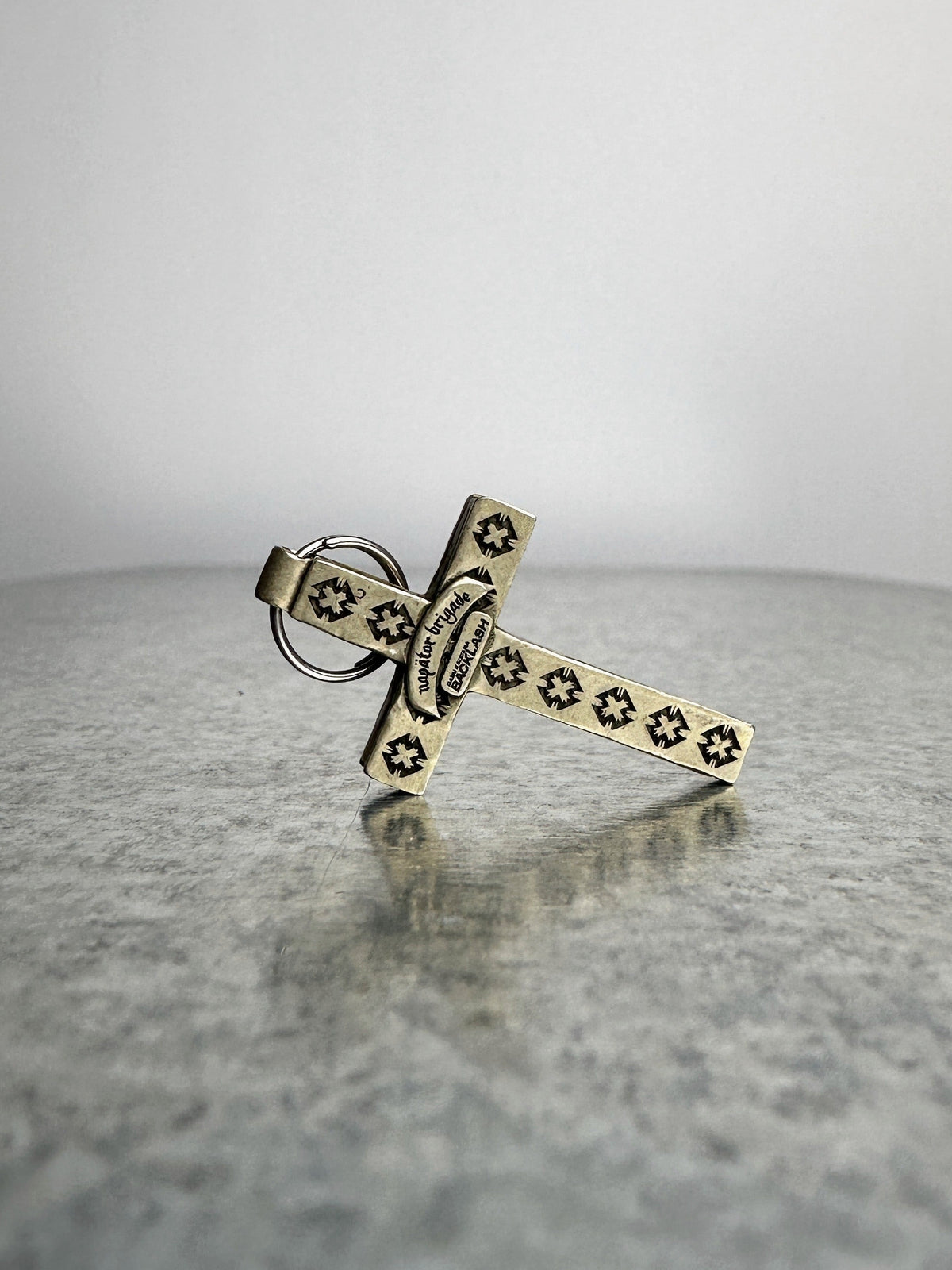 Reverse, cross-stamped down both arms