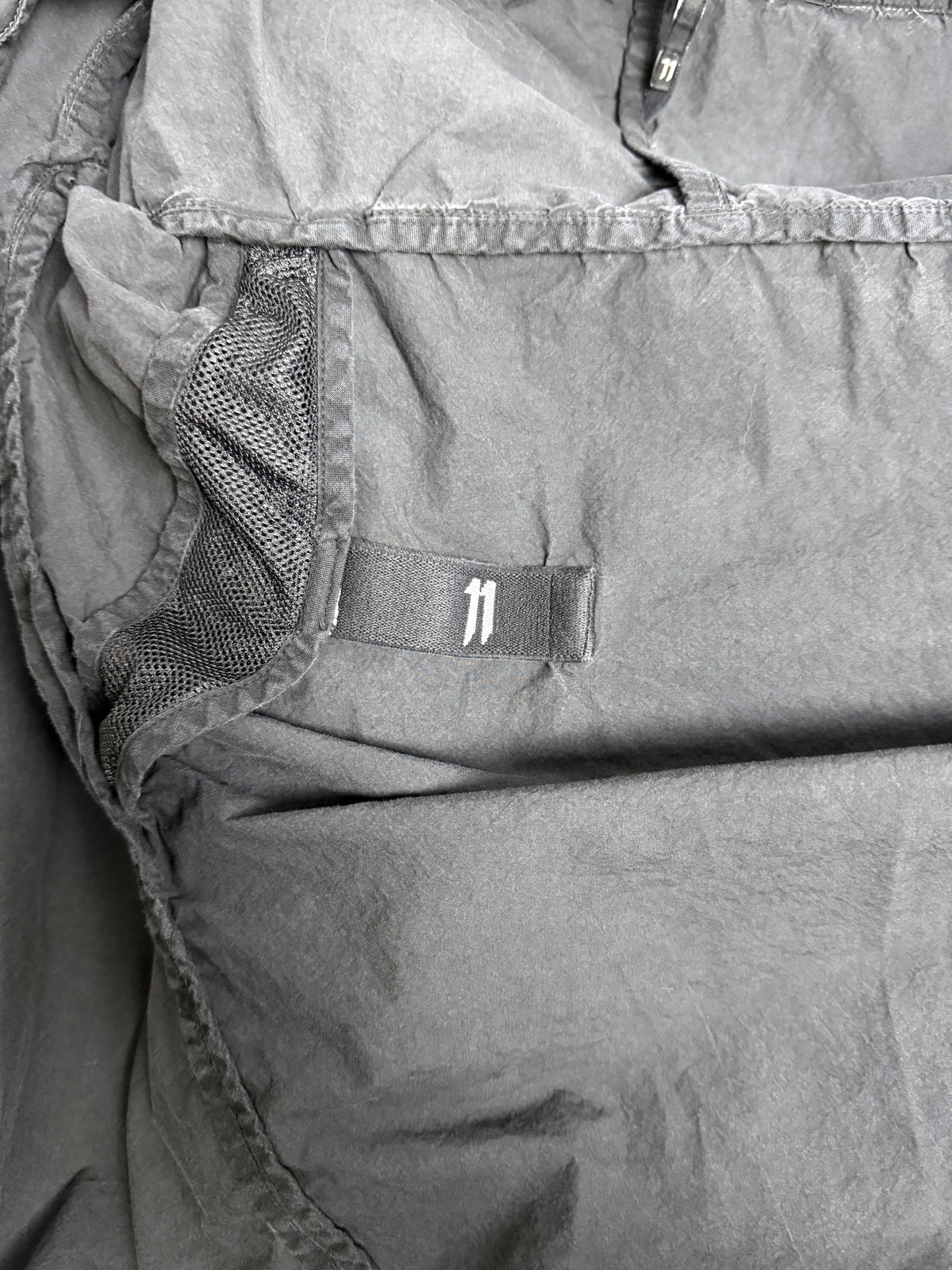 Interior, mesh-backed vent and 11 tab