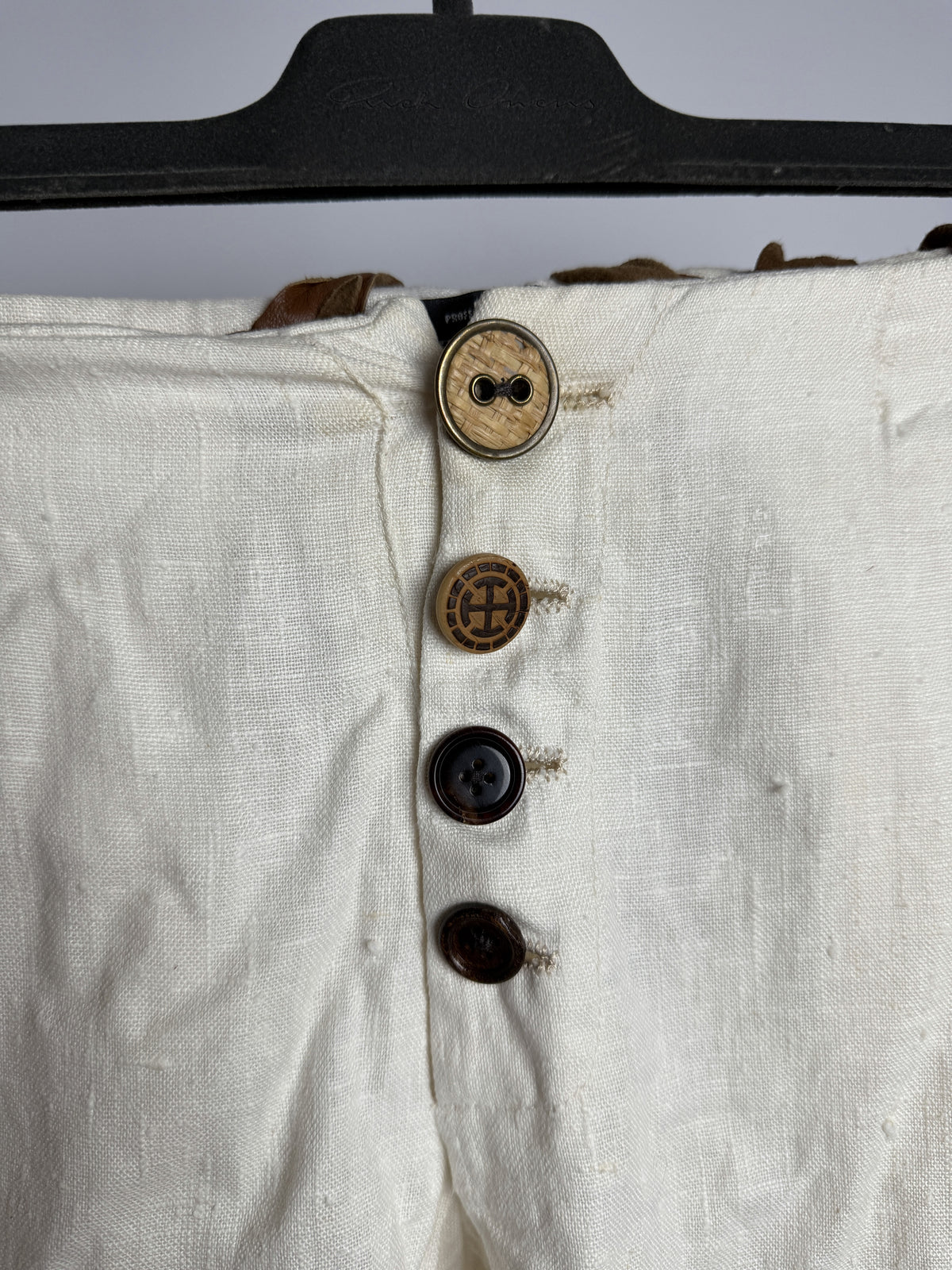 Mismatched antique buttons on the fly