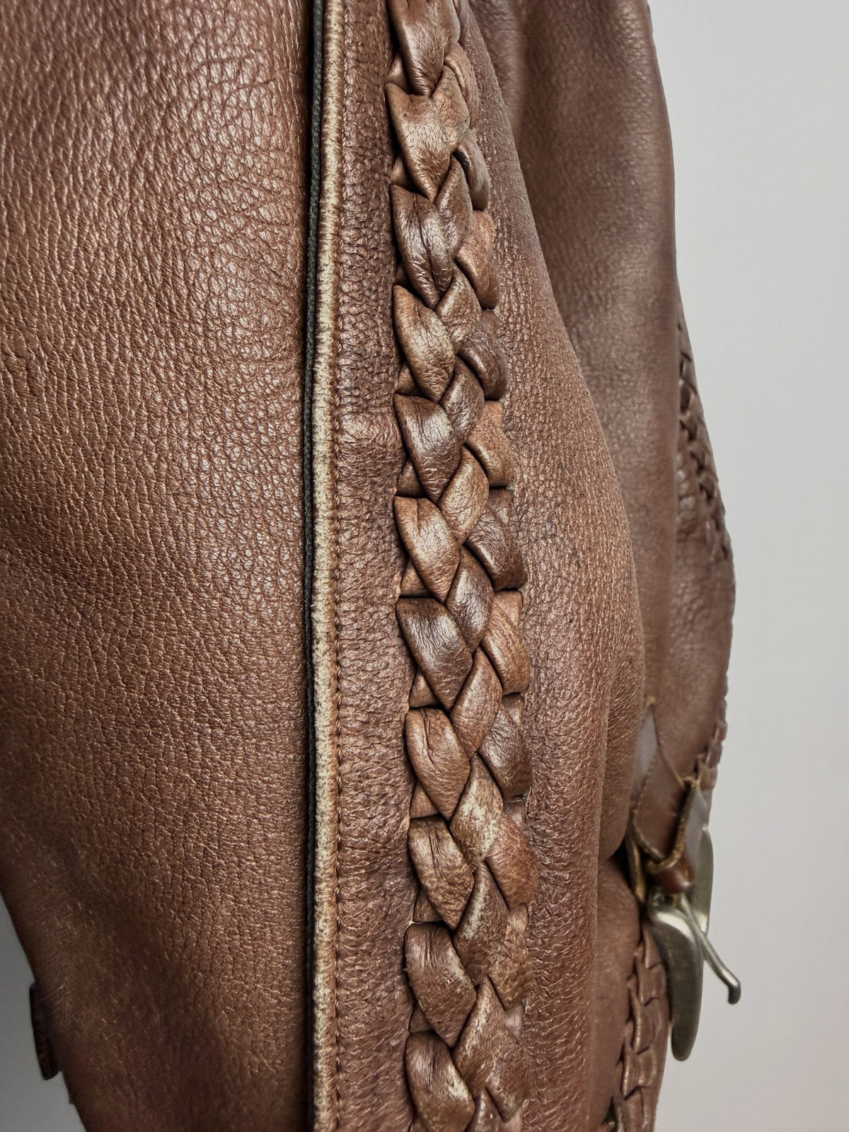 Hand-braided leather trim, close