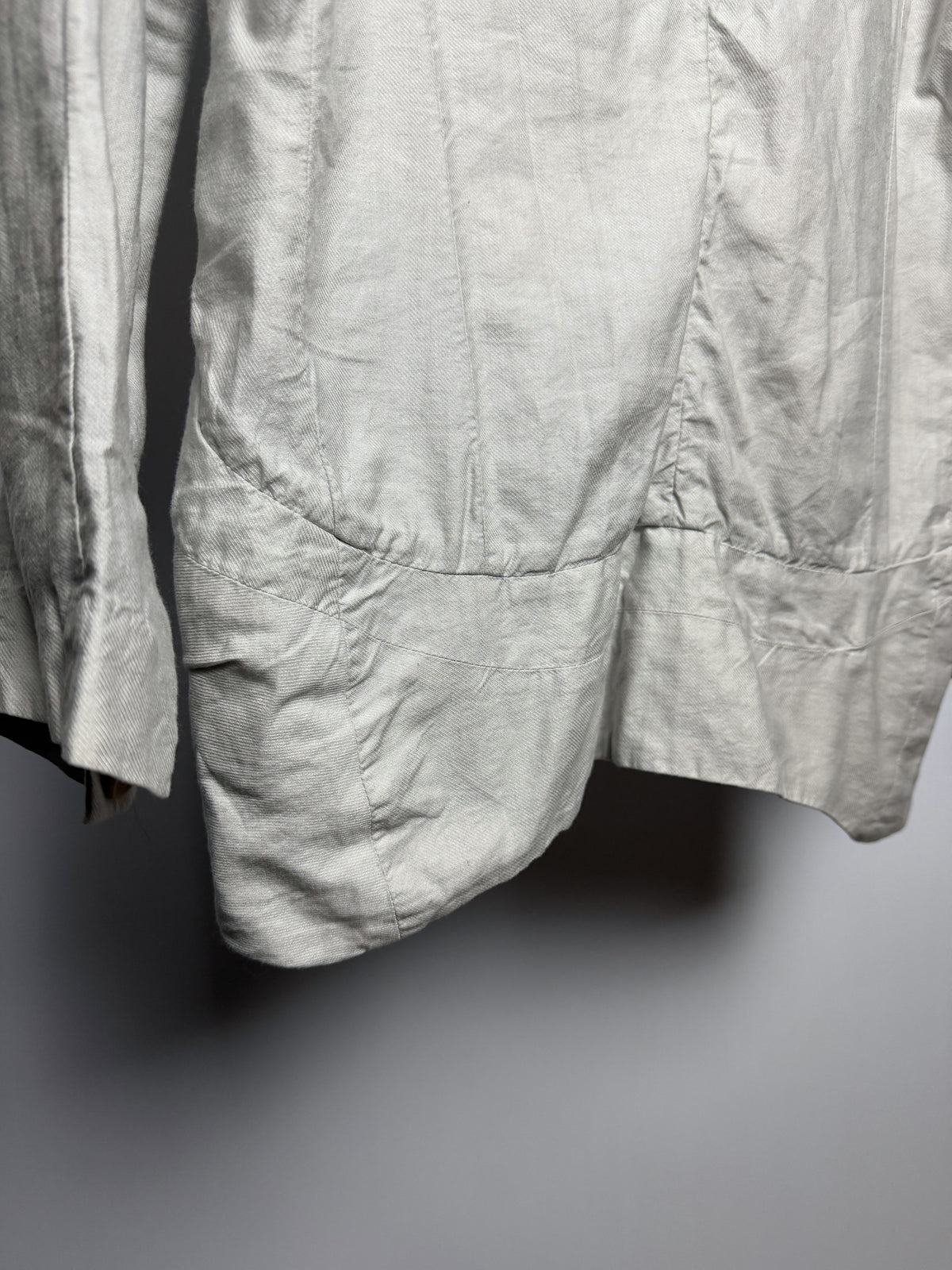 Banded hem drawing the skirt inward