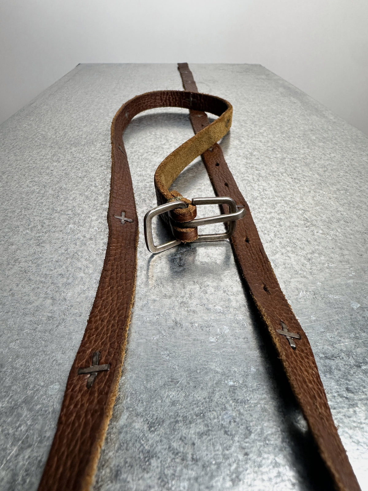 Buckle and strap, along the length