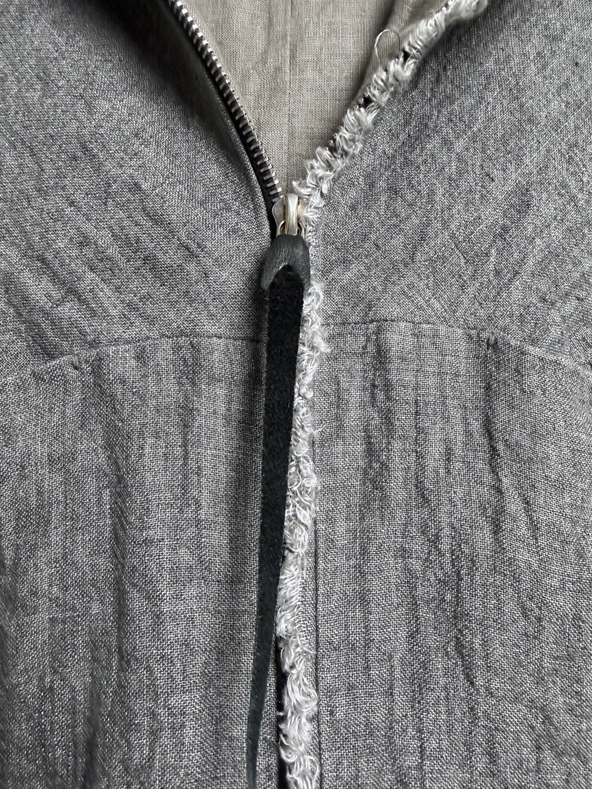 Zip with black leather pull