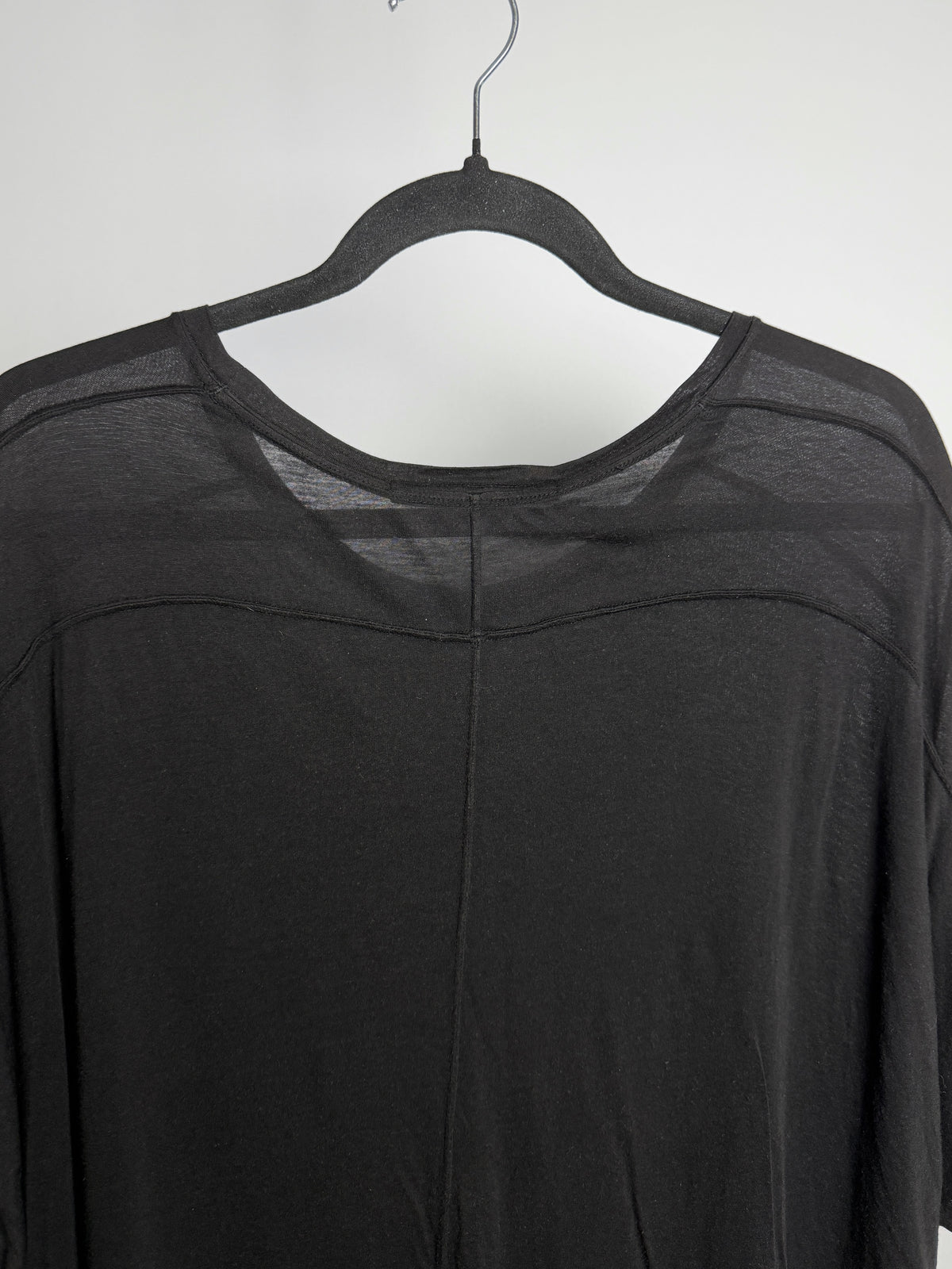 Curved yoke seam across the back