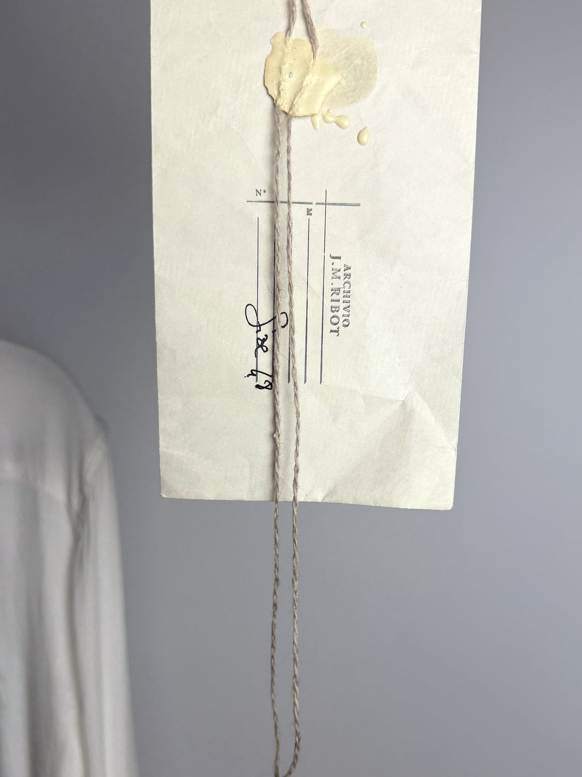 Original ARCHIVIO J.M. Ribot paper tag, hand-numbered and wax-sealed