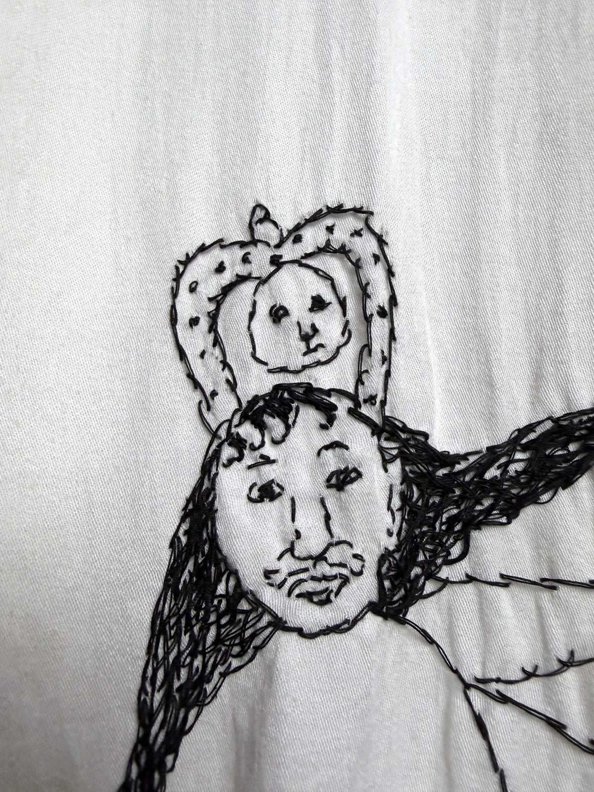 Crowned figure at the lower back, close