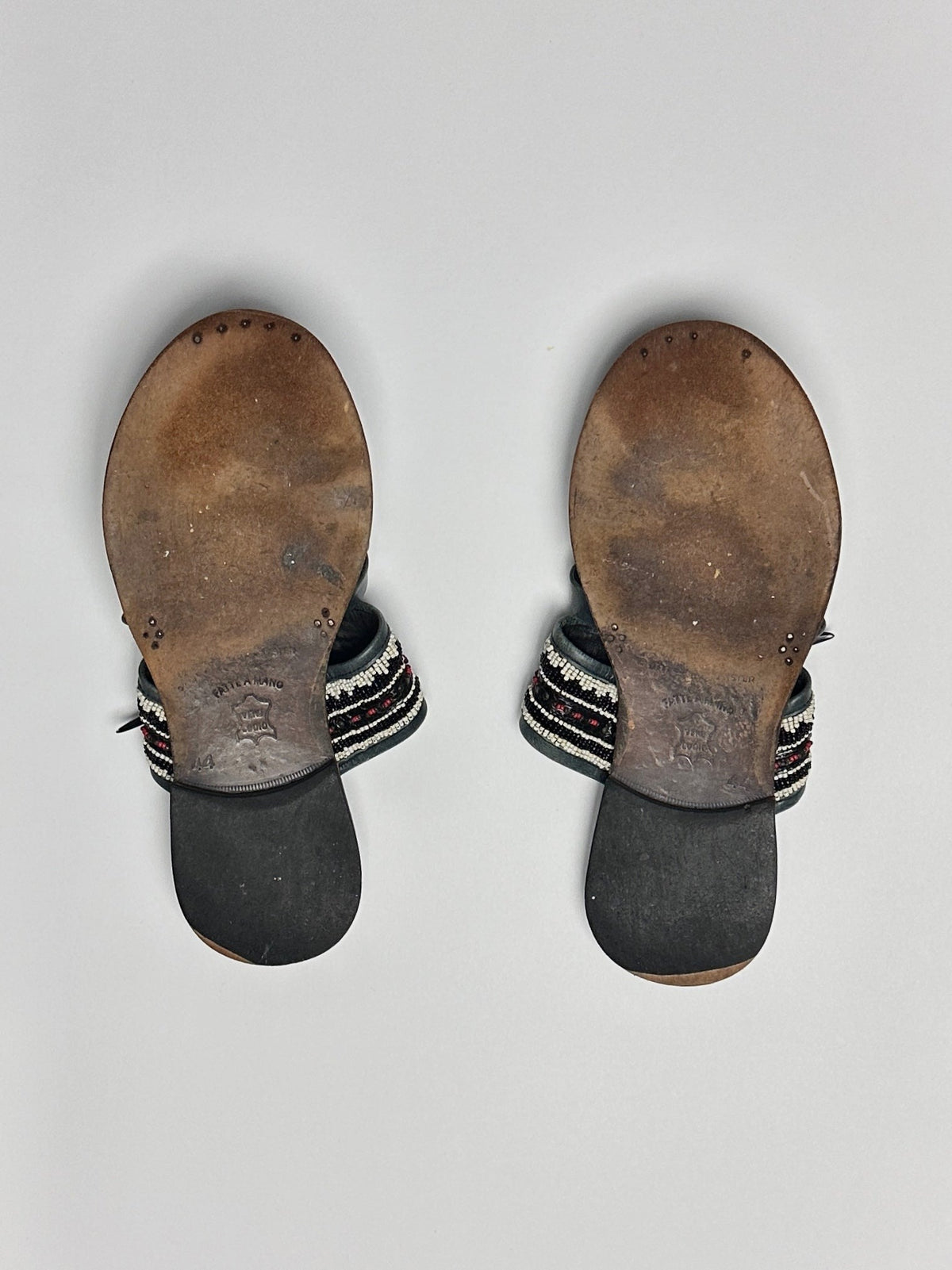 Both soles, showing wear